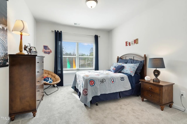 bedroom with light carpet, baseboards, and visible vents