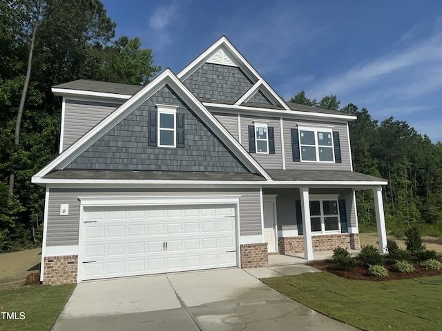 507 Olivia Crossing Ct Unit 20, Four Oaks, NC 27524 - craftsman inspired home with concrete driveway, a porch, brick siding, and a garage
