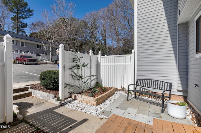 view of patio featuring fence