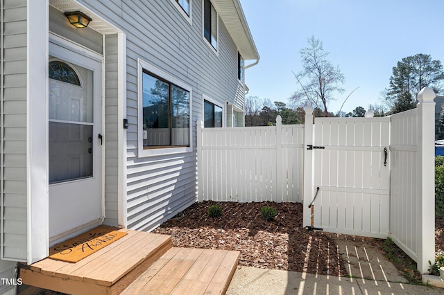 exterior space featuring fence and a gate