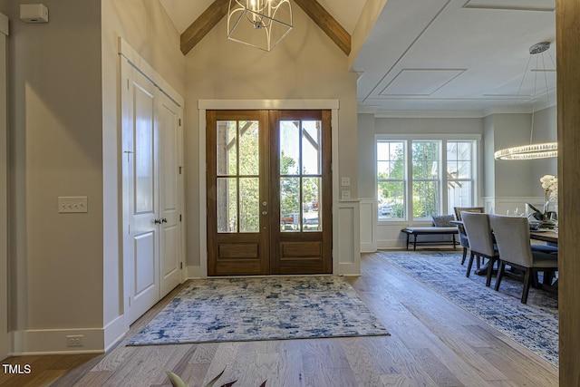 25 Blackhorn Ct, Pittsboro, NC 27312 - foyer with french doors, a wainscoted wall, lofted ceiling, a decorative wall, and wood finished floors