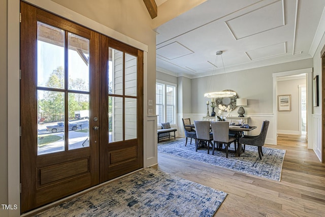 25 Blackhorn Ct, Pittsboro, NC 27312 - foyer featuring a decorative wall, light wood-style floors, french doors, ornamental molding, and wainscoting
