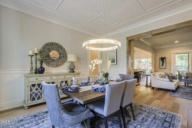 25 Blackhorn Ct, Pittsboro, NC 27312 - dining area featuring a wainscoted wall, ornamental molding, wood finished floors, and a decorative wall