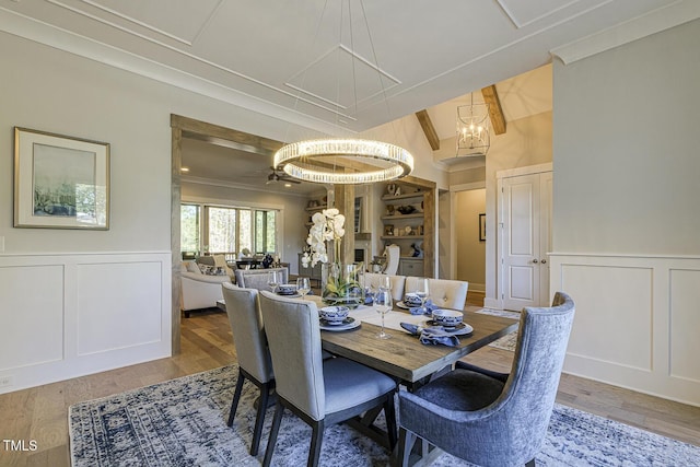 25 Blackhorn Ct, Pittsboro, NC 27312 - dining room with a wainscoted wall, crown molding, wood finished floors, and a decorative wall