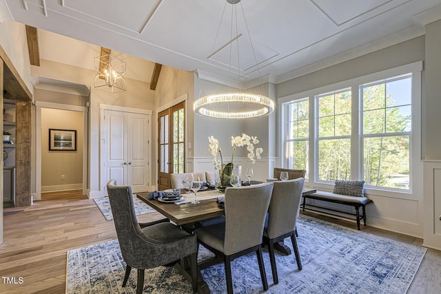 25 Blackhorn Ct, Pittsboro, NC 27312 - dining room with a decorative wall, beamed ceiling, wood finished floors, and a notable chandelier