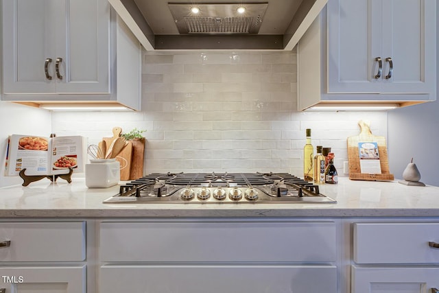 25 Blackhorn Ct, Pittsboro, NC 27312 - kitchen with premium range hood, stainless steel gas stovetop, decorative backsplash, and light stone countertops