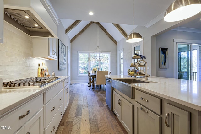 25 Blackhorn Ct, Pittsboro, NC 27312 - kitchen with appliances with stainless steel finishes, hanging light fixtures, custom exhaust hood, white cabinetry, and a sink