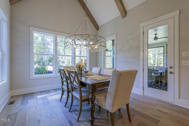 25 Blackhorn Ct, Pittsboro, NC 27312 - dining space with a chandelier, visible vents, vaulted ceiling with beams, and wood finished floors