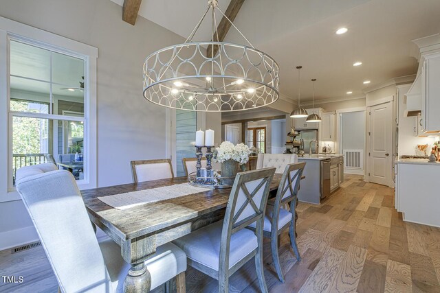 25 Blackhorn Ct, Pittsboro, NC 27312 - dining room featuring visible vents, vaulted ceiling with beams, light wood-type flooring, a chandelier, and recessed lighting