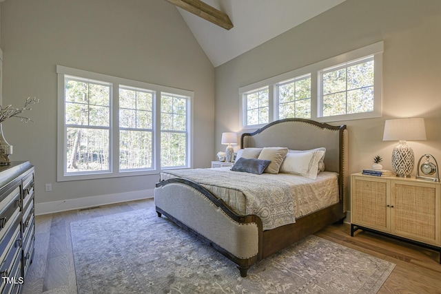 25 Blackhorn Ct, Pittsboro, NC 27312 - bedroom featuring high vaulted ceiling, dark wood-style flooring, visible vents, and baseboards