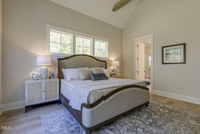25 Blackhorn Ct, Pittsboro, NC 27312 - bedroom featuring ensuite bathroom, high vaulted ceiling, wood finished floors, and baseboards