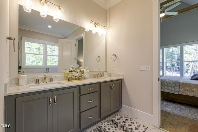25 Blackhorn Ct, Pittsboro, NC 27312 - ensuite bathroom featuring ornamental molding, a sink, a ceiling fan, and connected bathroom