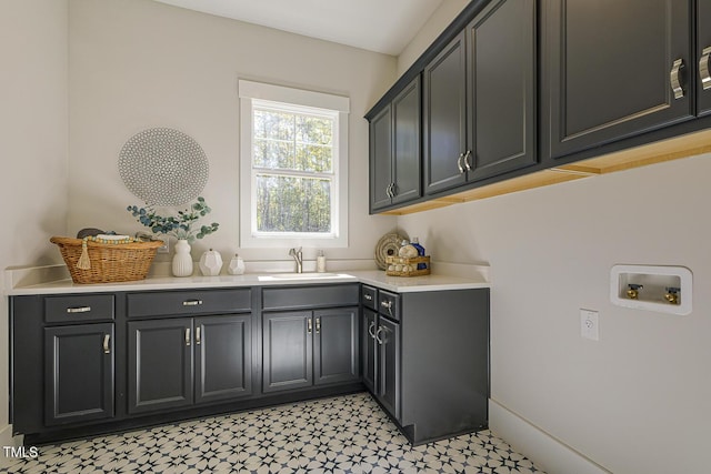 25 Blackhorn Ct, Pittsboro, NC 27312 - laundry room with washer hookup, cabinet space, a sink, and light floors