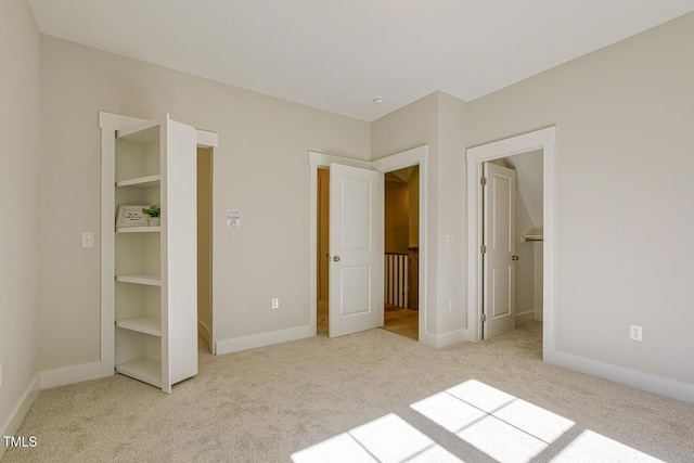 25 Blackhorn Ct, Pittsboro, NC 27312 - unfurnished bedroom featuring baseboards, a spacious closet, and light colored carpet