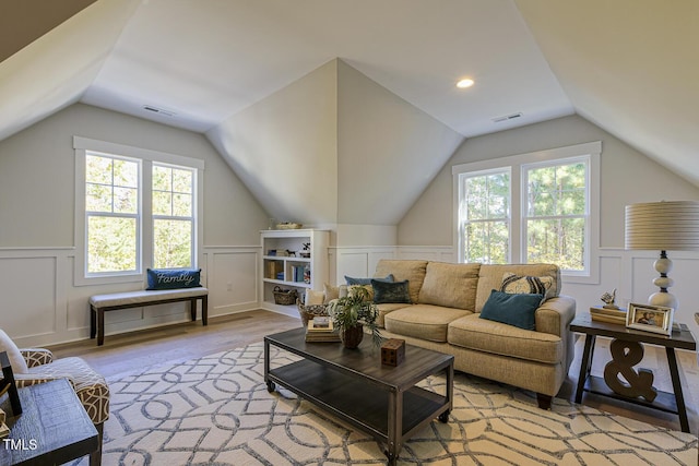 25 Blackhorn Ct, Pittsboro, NC 27312 - interior space featuring light wood-style floors, vaulted ceiling, visible vents, and plenty of natural light