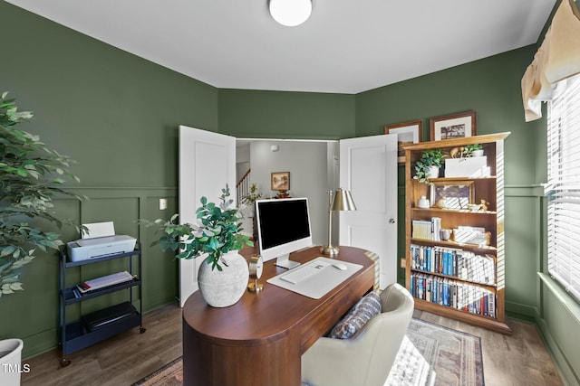 office featuring wood finished floors and wainscoting