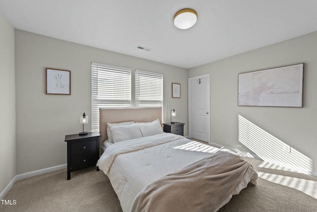 bedroom featuring light carpet, visible vents, and baseboards