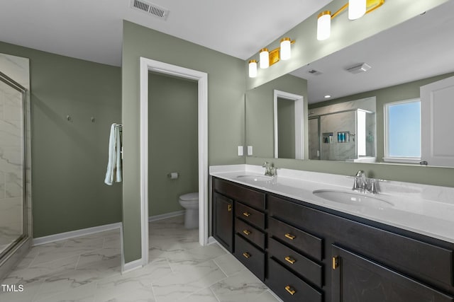 bathroom with marble finish floor, baseboards, visible vents, and a sink