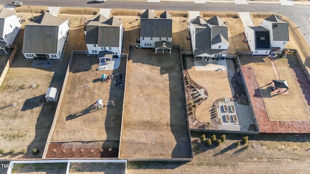 birds eye view of property with a residential view