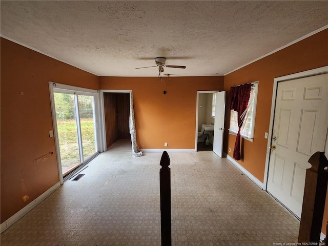 421 Durant Dr, Fayetteville, NC 28304 - interior space featuring a ceiling fan, visible vents, a textured ceiling, and baseboards