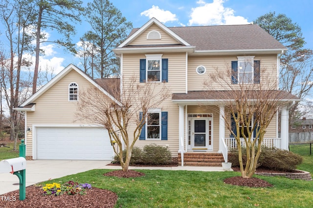 traditional home featuring a front lawn, covered porch, driveway, and a shingled roof