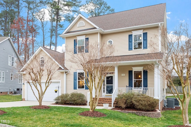 traditional home with driveway, a front lawn, cooling unit, covered porch, and an attached garage