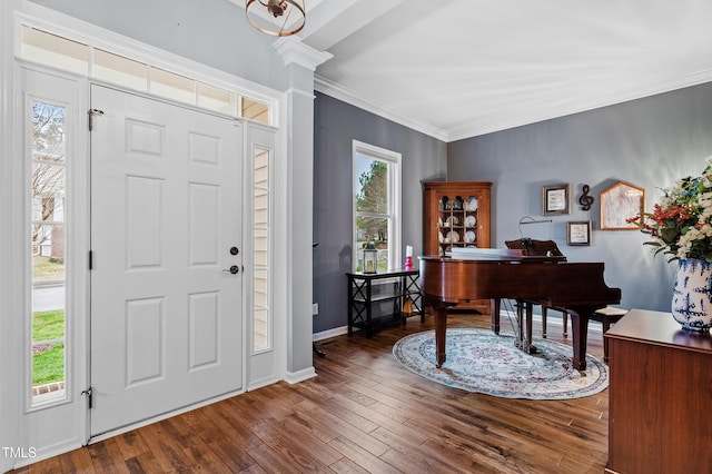 entryway with crown molding, baseboards, and dark wood-style flooring