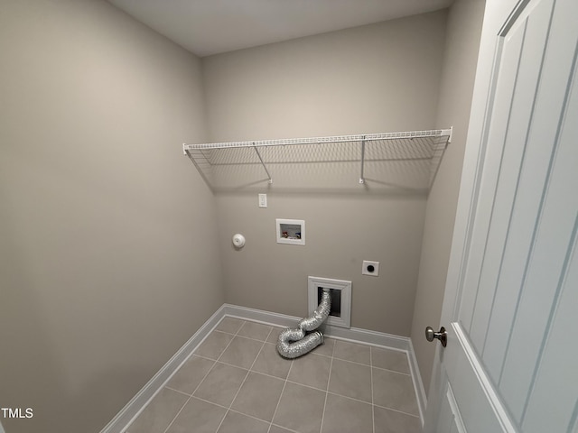 laundry area with light tile patterned flooring, laundry area, washer hookup, baseboards, and electric dryer hookup