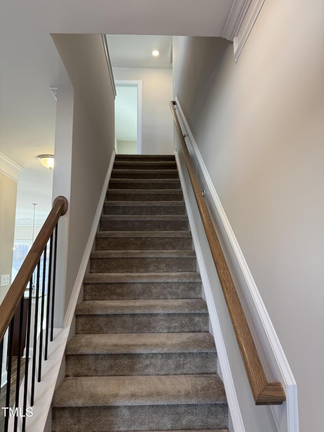 stairway featuring recessed lighting