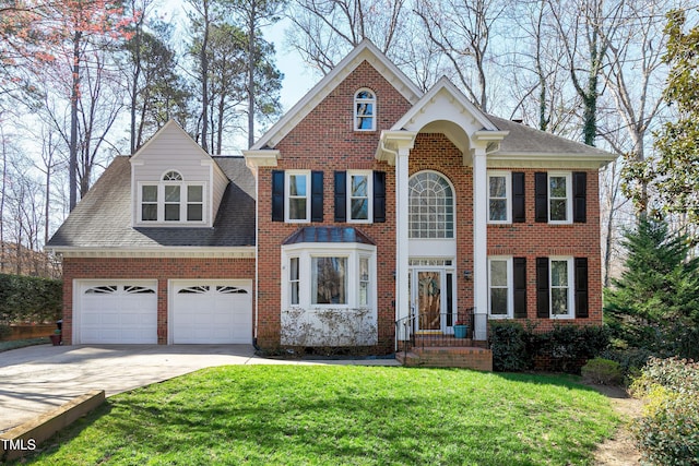 view of front facade featuring a front lawn, driveway, roof with shingles, an attached garage, and brick siding