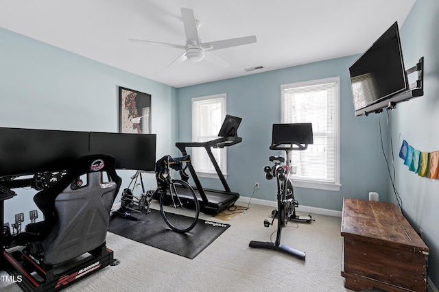 exercise room with visible vents, carpet, baseboards, and ceiling fan