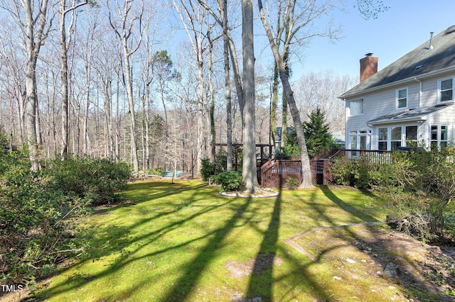 view of yard featuring a wooden deck