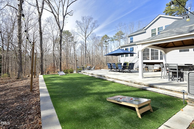 view of yard featuring a patio area and outdoor dining area