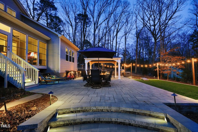 view of patio / terrace with a gazebo and outdoor dining area