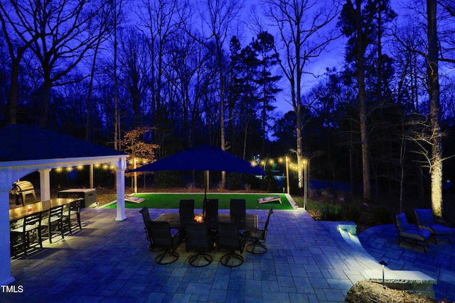 view of swimming pool with a gazebo, outdoor dining area, and a patio