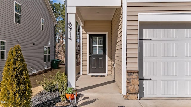 doorway to property featuring stone siding