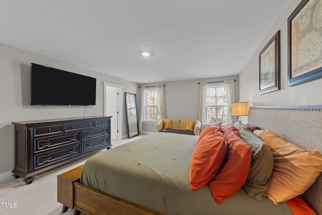 bedroom with carpet floors and baseboards