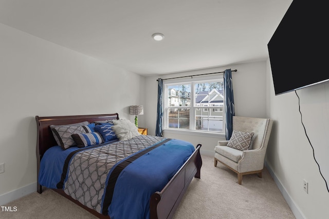 carpeted bedroom with baseboards