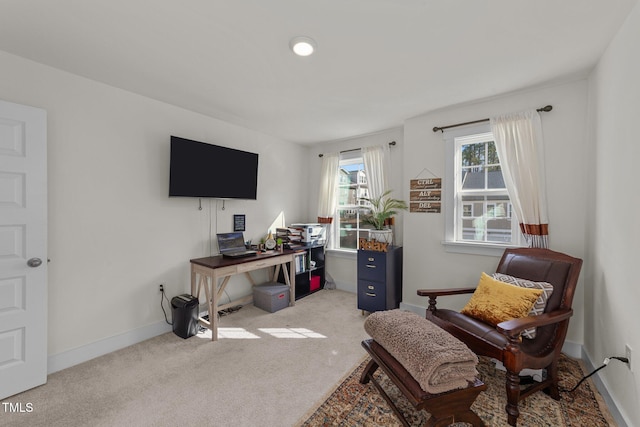 carpeted office featuring baseboards