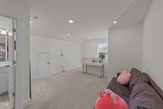 interior space featuring baseboards, recessed lighting, visible vents, and light colored carpet