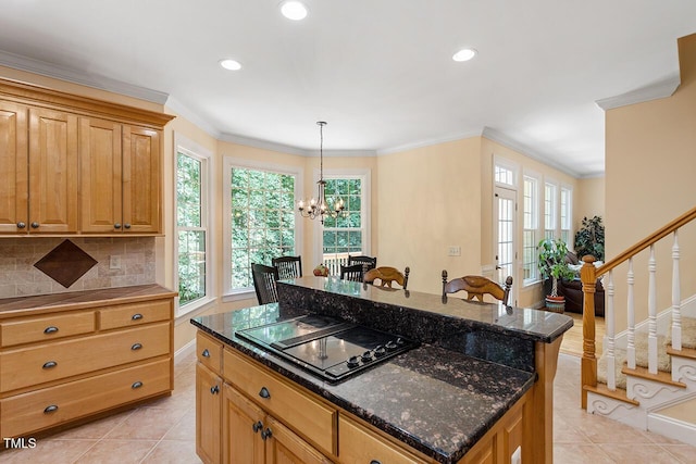 kitchen featuring ornamental molding, black electric stovetop, and light tile patterned floors