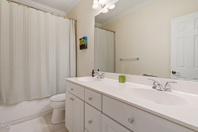 bathroom with toilet, crown molding, double vanity, and a sink