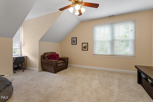 living area featuring a healthy amount of sunlight, visible vents, and carpet flooring