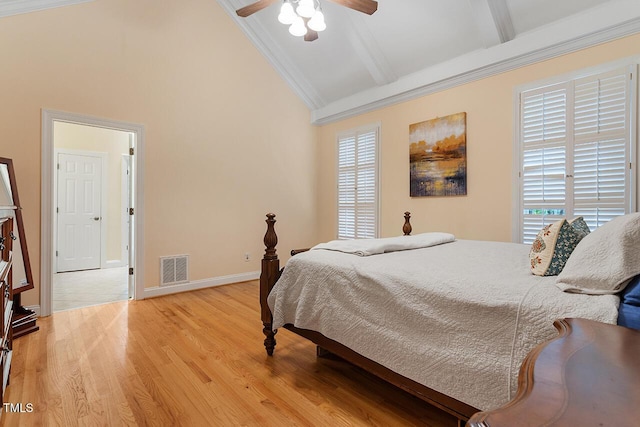 bedroom featuring baseboards, visible vents, beamed ceiling, light wood-type flooring, and high vaulted ceiling