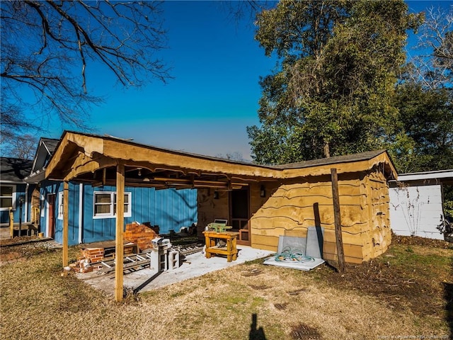 rear view of house with a patio