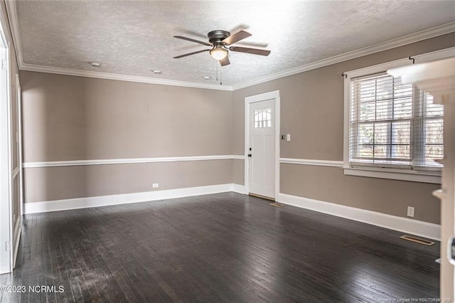 foyer entrance featuring a textured ceiling, dark wood finished floors, and baseboards