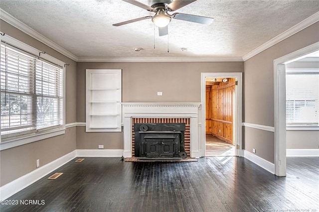 unfurnished living room featuring visible vents, baseboards, dark wood-style floors, a textured ceiling, and crown molding