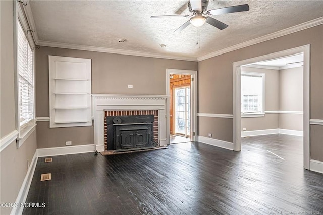 unfurnished living room with baseboards, ornamental molding, dark wood finished floors, and a textured ceiling