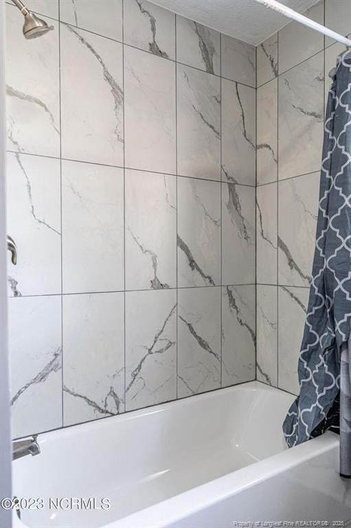 full bathroom featuring shower / tub combo