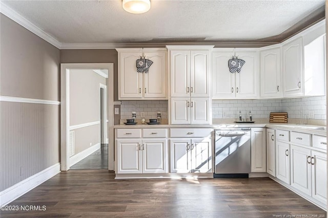 kitchen featuring light countertops, stainless steel dishwasher, dark wood-style flooring, and white cabinetry